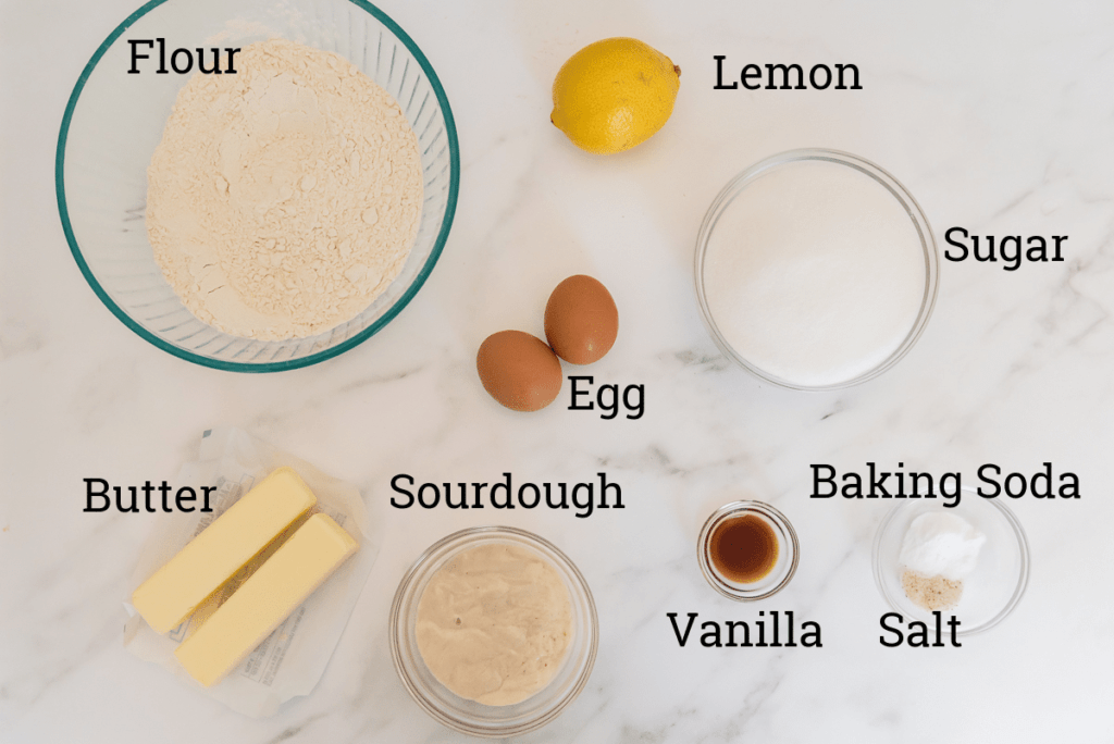 ingredients for lemon cookies on marble counter with text overlay