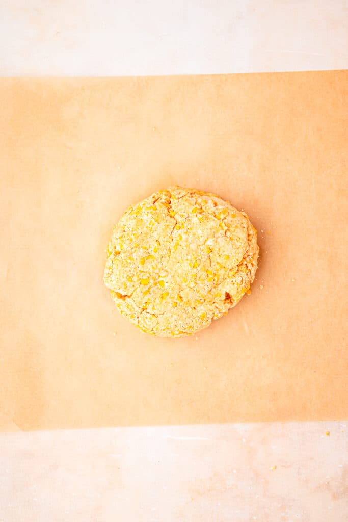 dough in ball on parchment paper