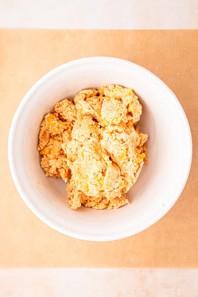 dough for cheese straws mixed together in white bowl