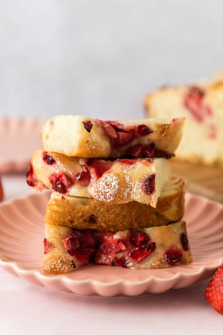 four slices of strawberry focaccia stacked on pink plate