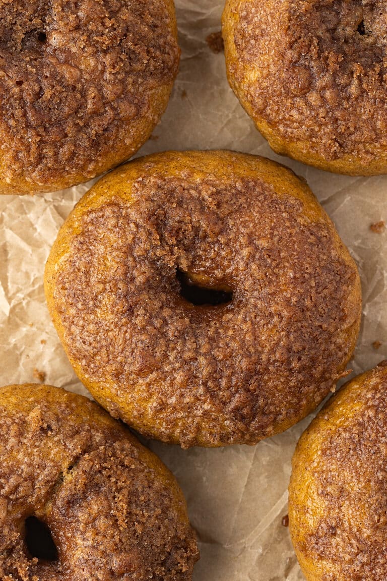 closeup of sourdough discard pumpkin bagels - one centered and one off center in each corner