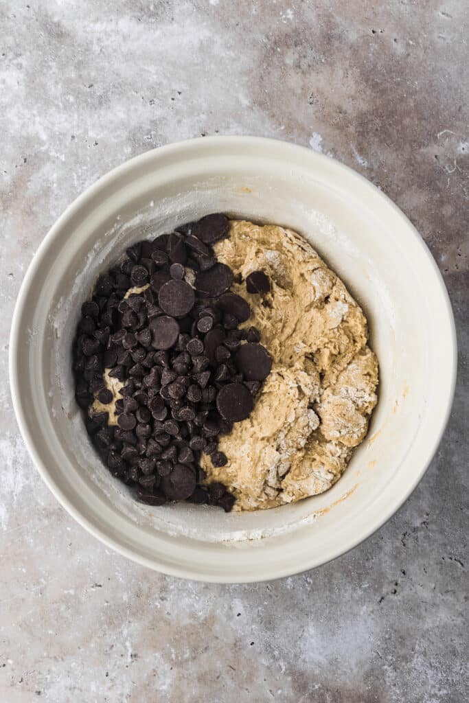 mixing bowl with cookie dough and chopped chocolate