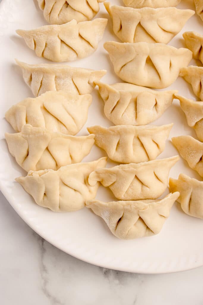 white plate filled with dumplings
