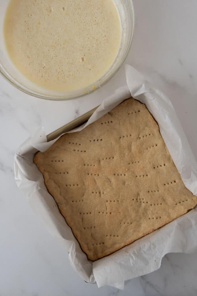 cooked crust and lemon filling in bowl