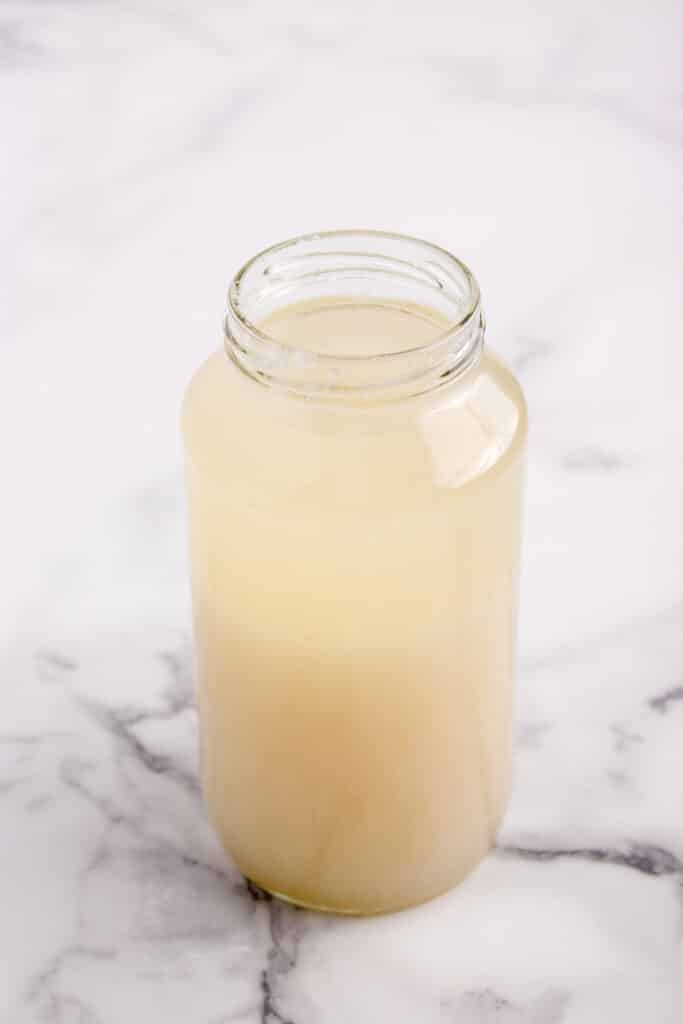 large glass jar with potato flake starter