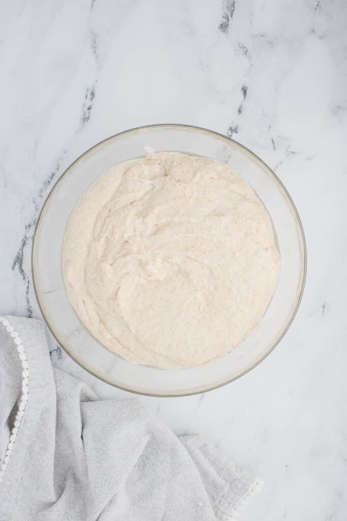 glass mixing bowl with dough for sourdough ciabatta