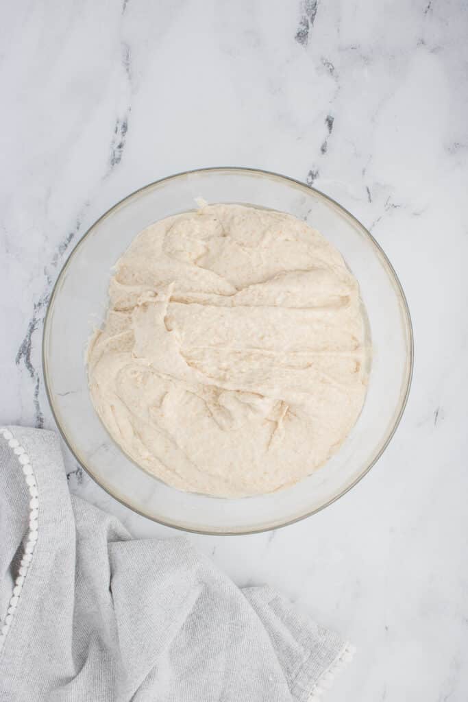 glass bowl with sourdough ciabatta dough after three rounds of stretch and folds