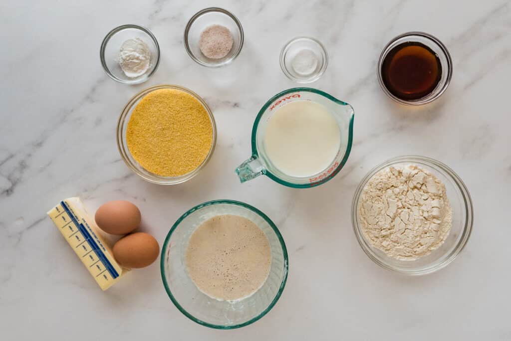 ingredients for sourdough corn muffins on marble counter