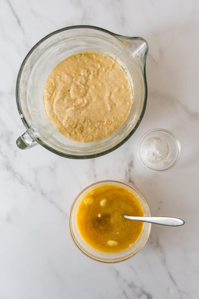 glass. bowl with sourdough corn and corn meal ferment and went ingredients