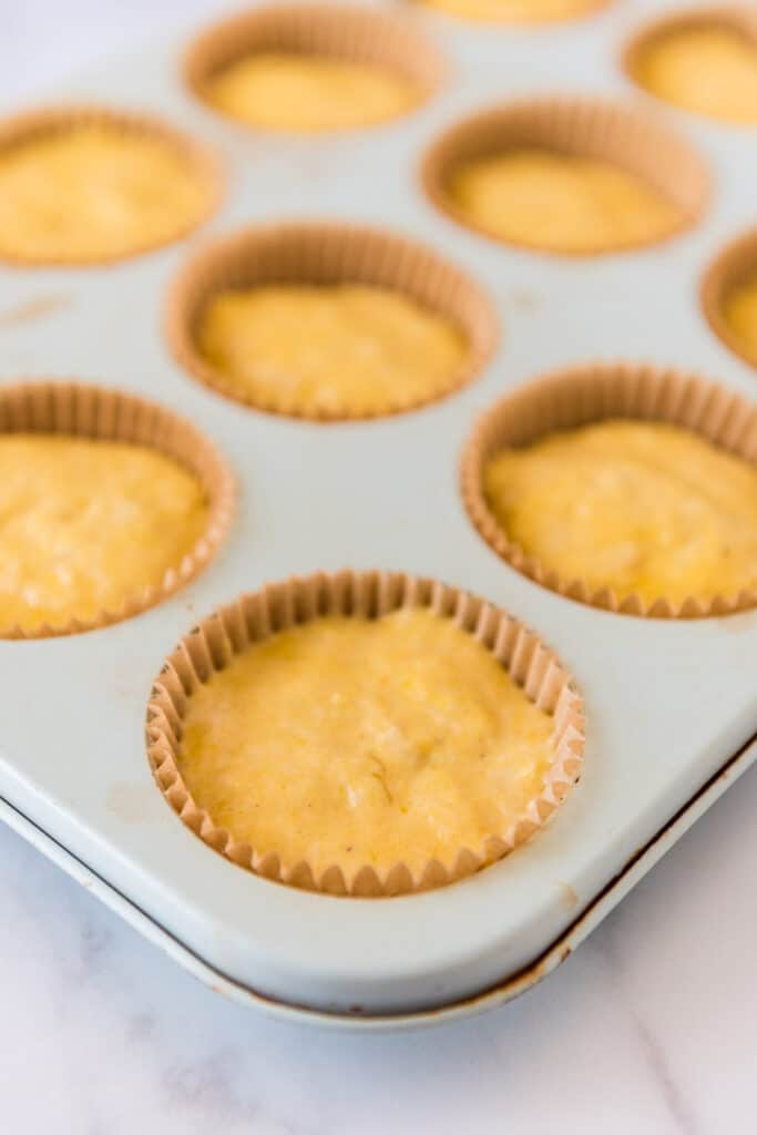 batter for cornbread muffins in muffin pan
