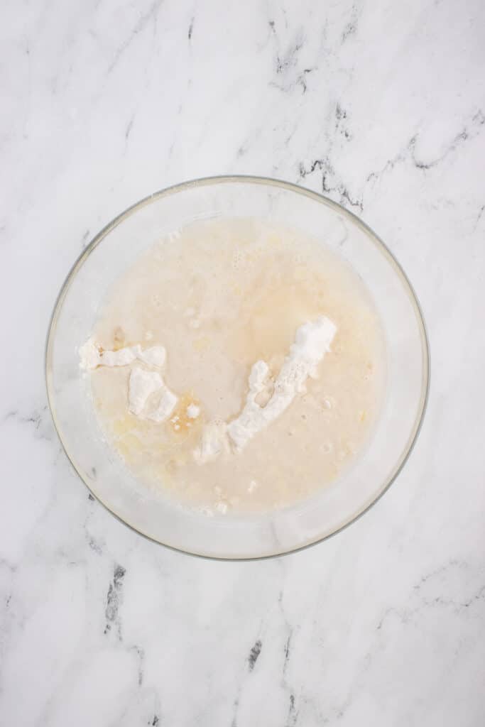 ingredientes for sourdough breadsticks in glass bowl ready to be mixed