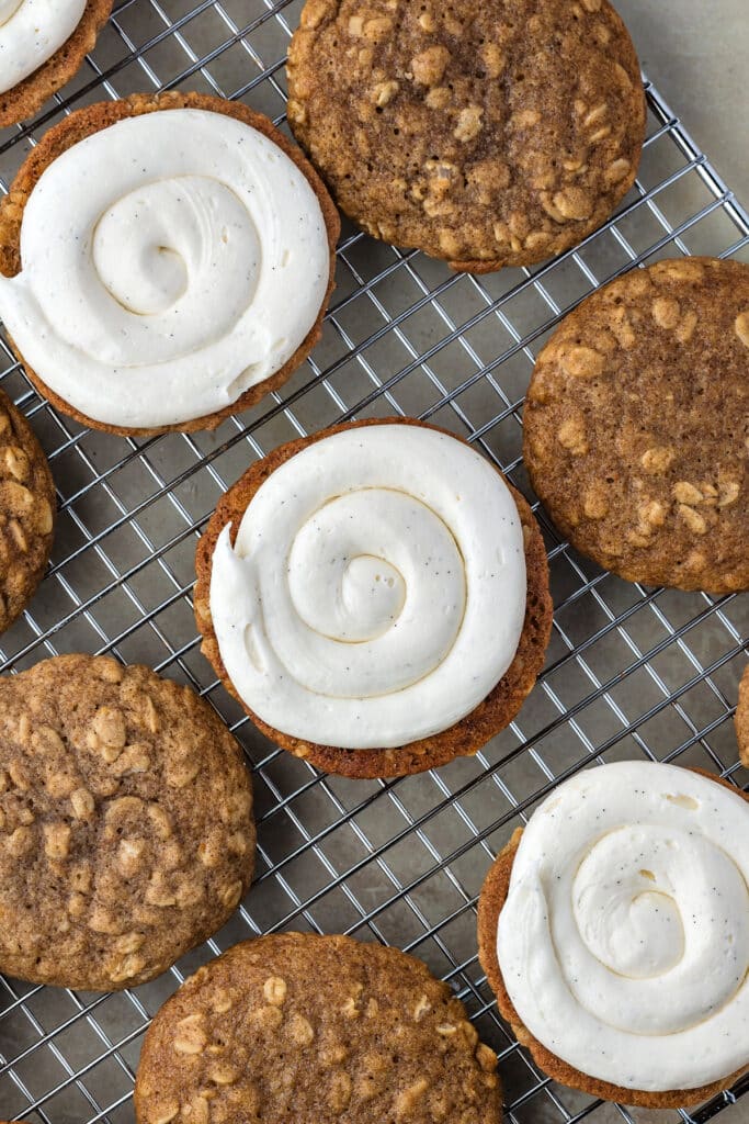 oatmeal cookies on wire cooling rack with middle row being filled with filling
