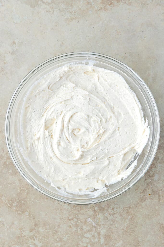 glass mixing bowl with cream filling for cookie sandwiches