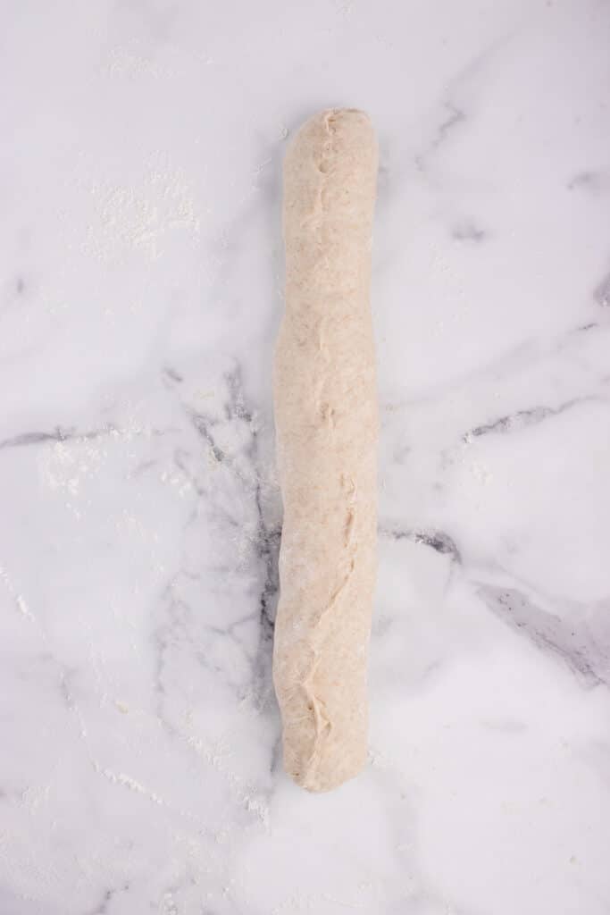 shaping French bread into log