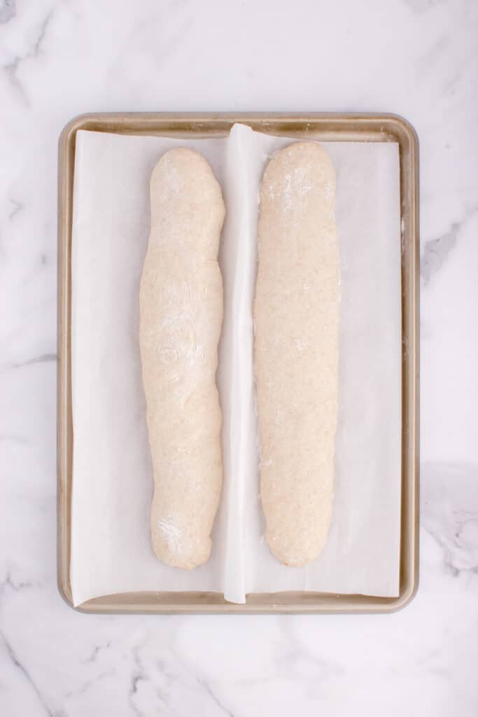 sourdough French bread  on baking pan before proofing