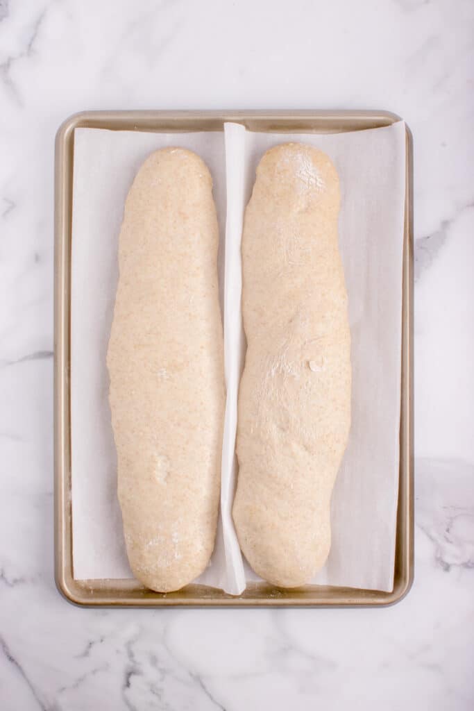 sourdough French bread  on baking pan after proofing