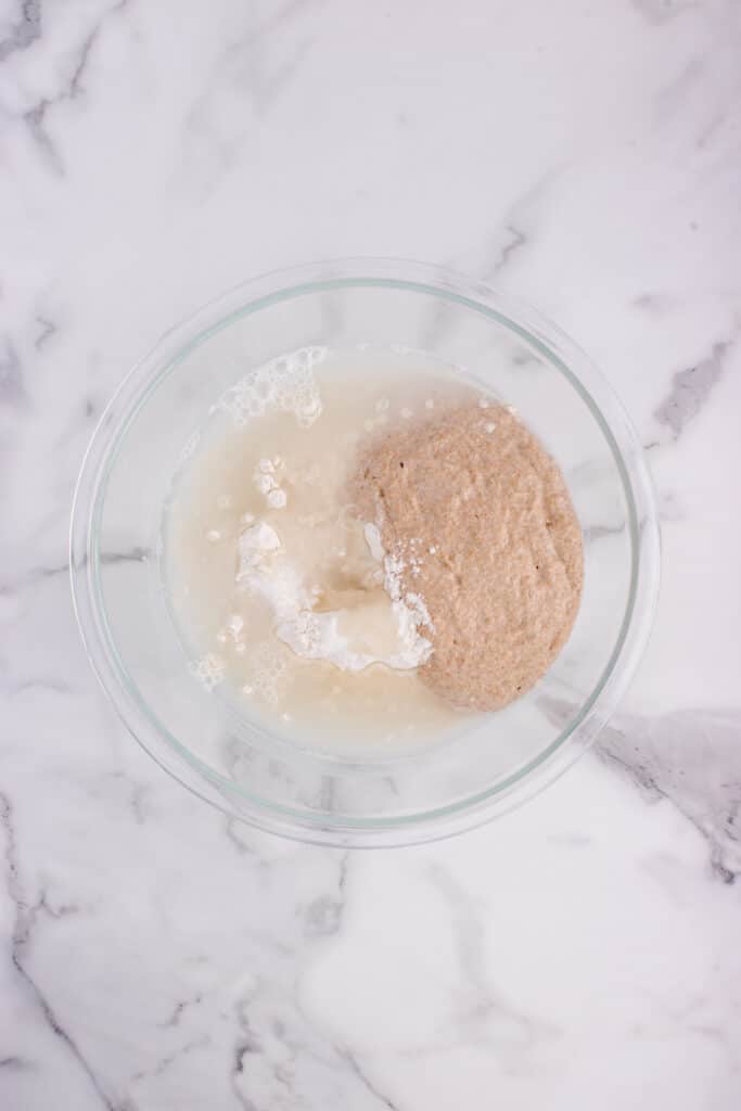 glass bowl with ingredients for sourdough French bread ready to be mixed