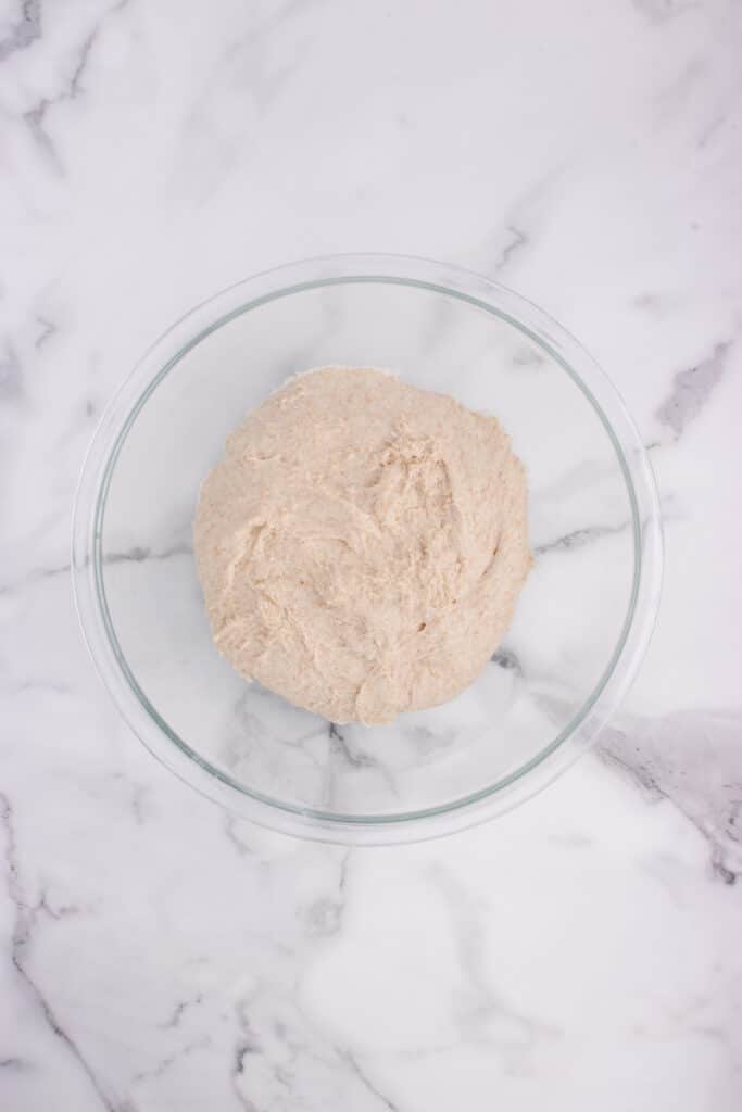 glass bowl with dough for French bread