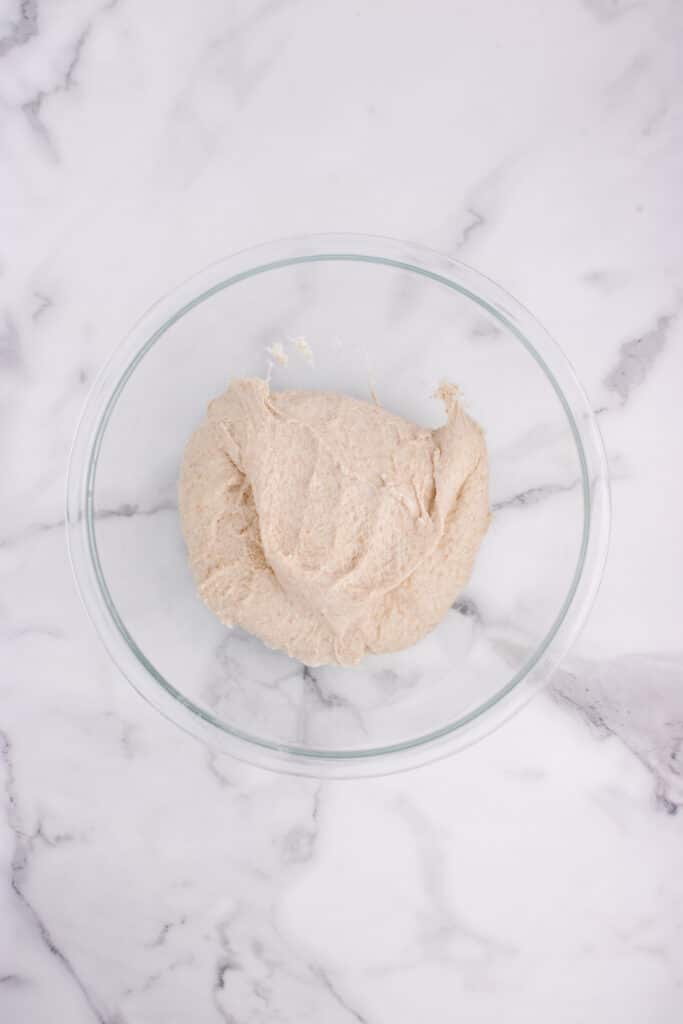 glass bowl with French bread dough after stretch and fold
