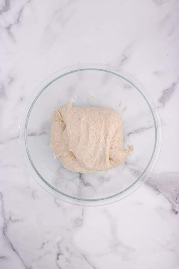 glass bowl with French bread dough after stretch and fold