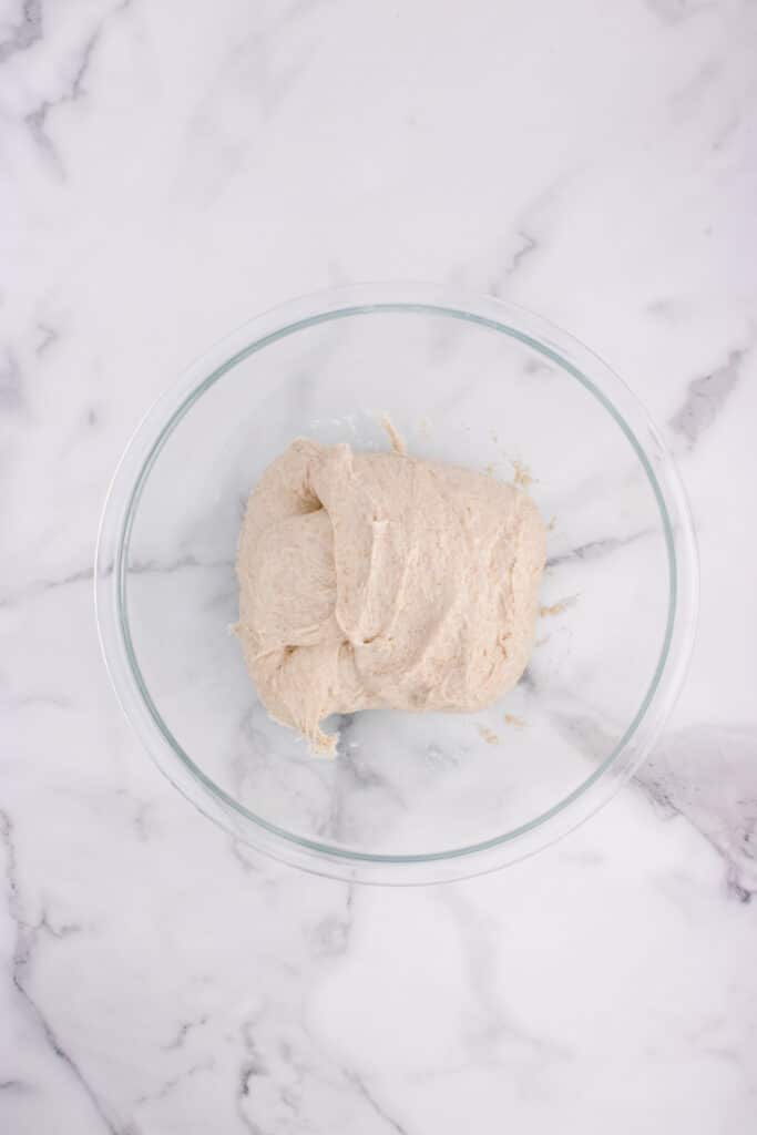 glass bowl with French bread dough after stretch and fold