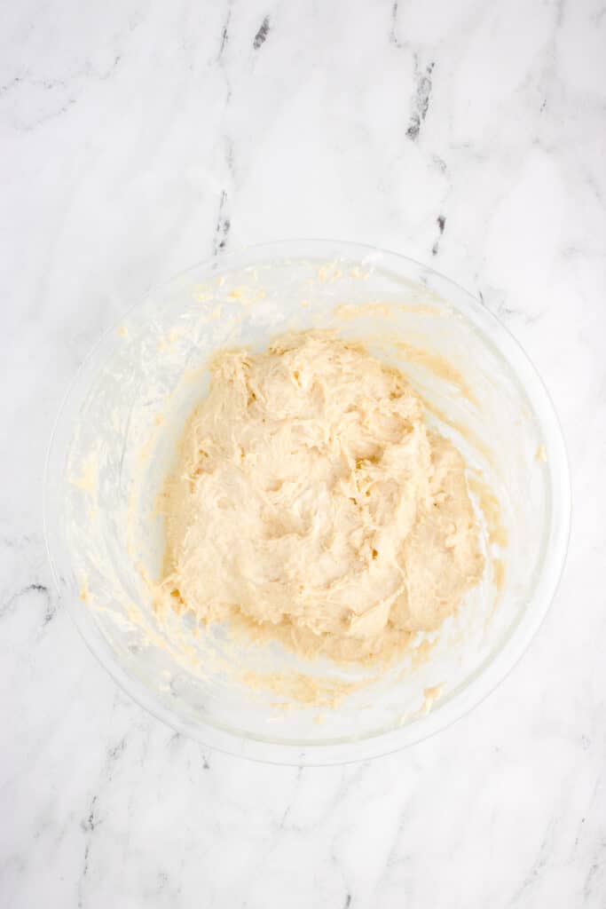 glass mixing bowl with dough for brioche mixed