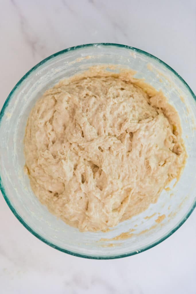 sourdough English muffin dough in large mixing bowl ready for stretch and folds