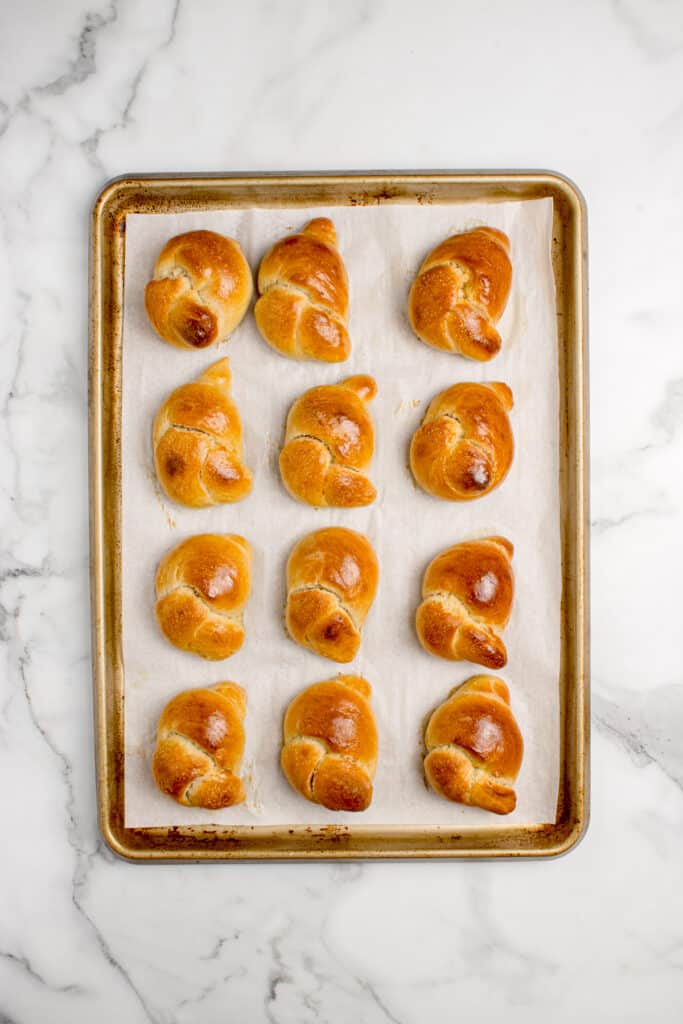 freshly baked sourdough garlic knots on baking tray