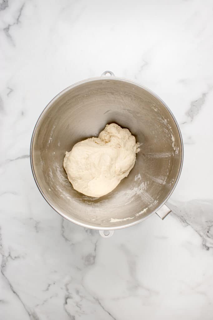 metal mixing bowl with mixed dough for sourdough garlic knots