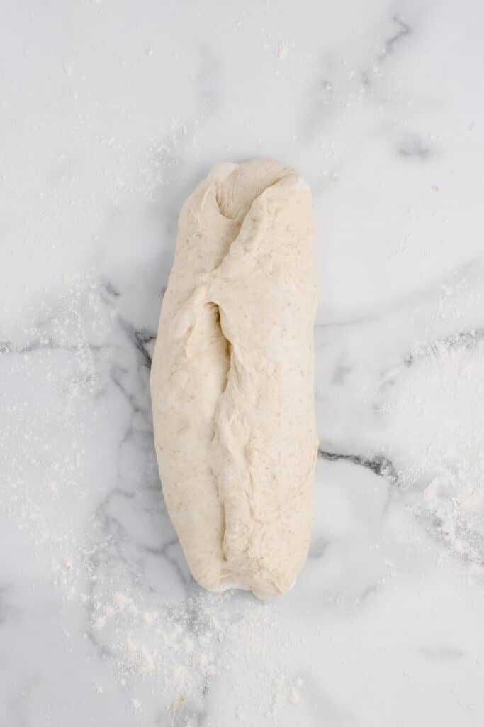 rectangle of dough rolled into log
