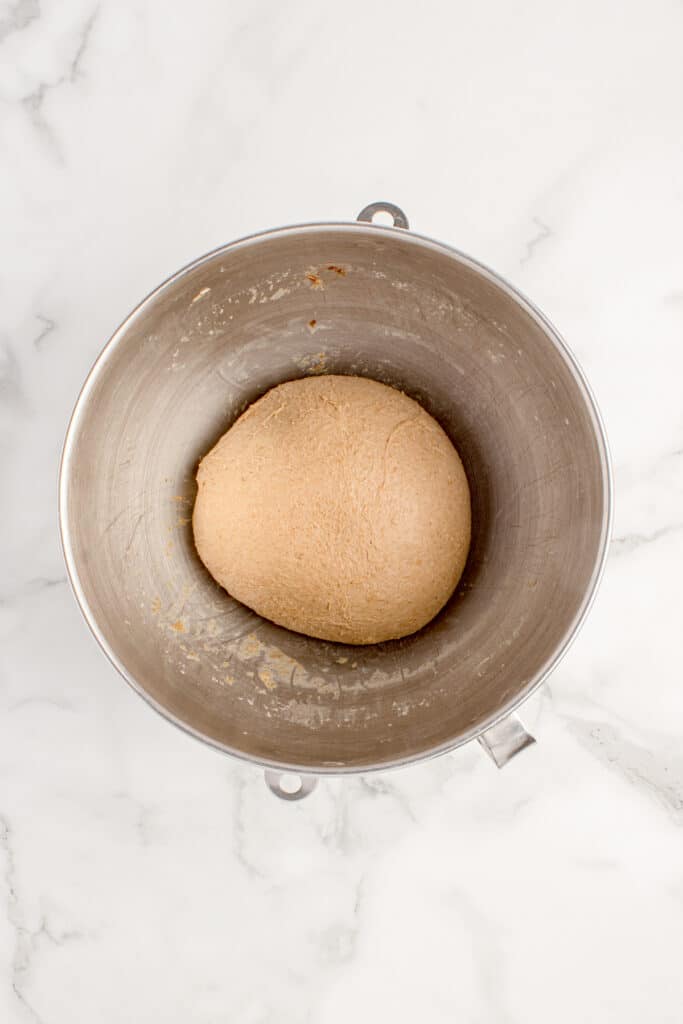 dough in metal mixing bowl before bulk fermentation