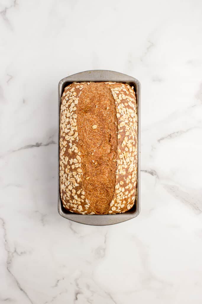 freshly baked brown bread in loaf pan