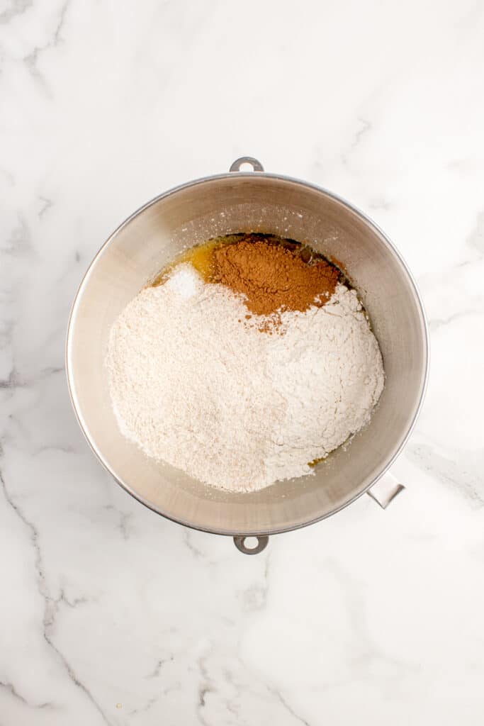 metal mixing bowl with flour and cocoa powder