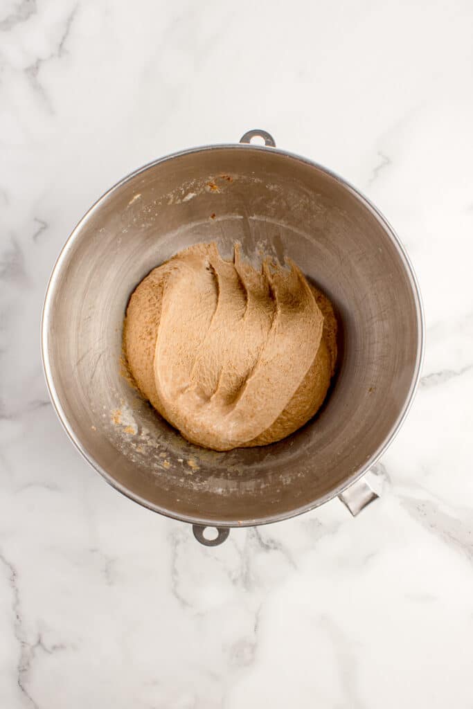 metal mixing bowl with bread dough after stretch and fold