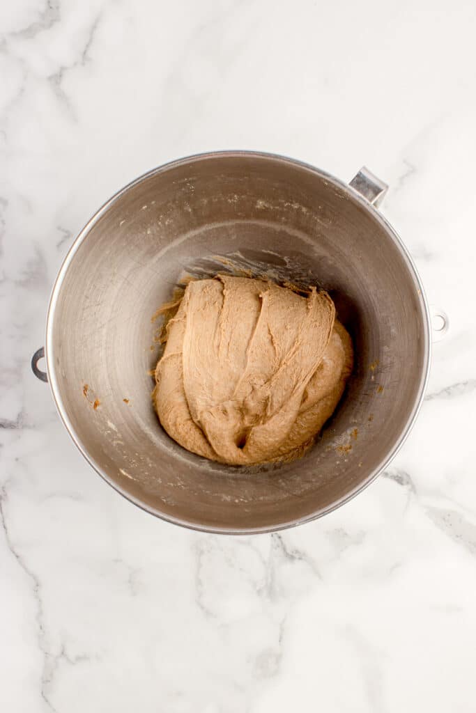 metal mixing bowl with bread dough after stretch and fold
