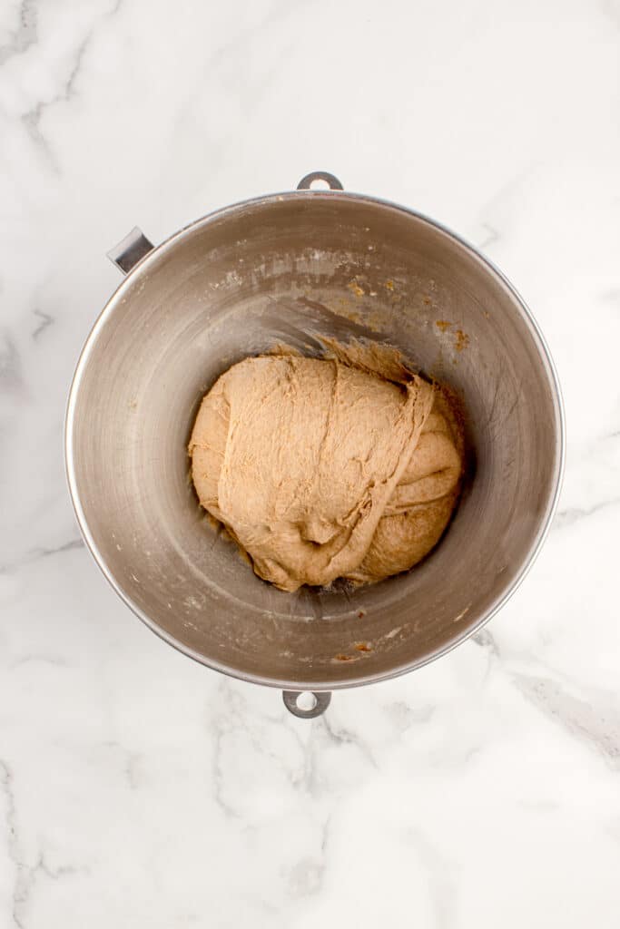 metal mixing bowl with bread dough after stretch and fold