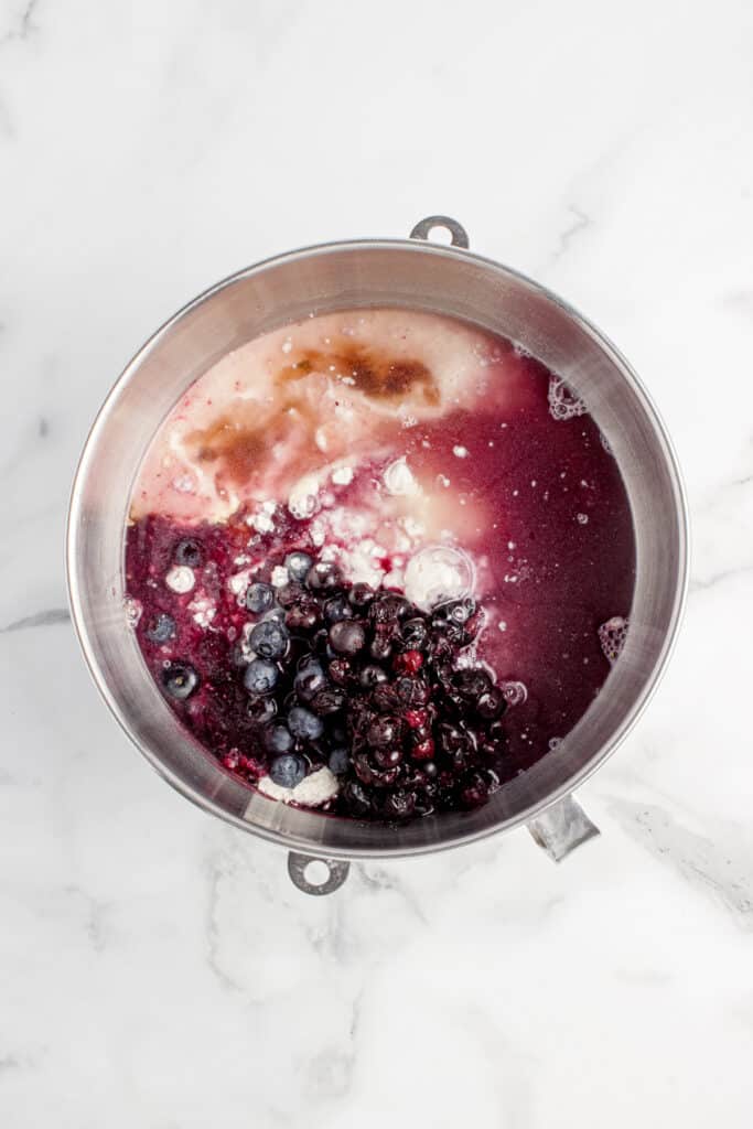 mixing bowl with ingredients for sourdough blueberry bagels