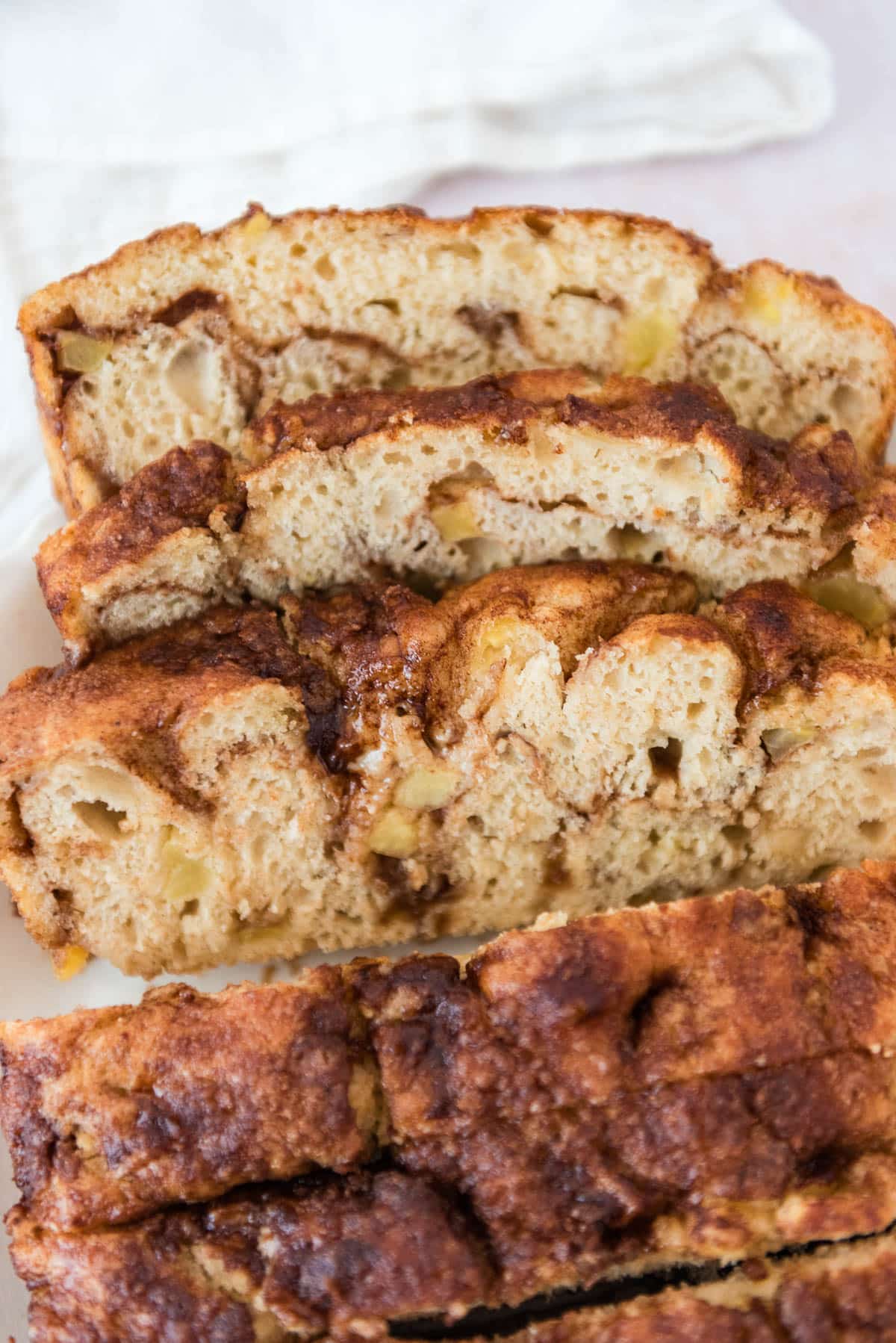 apple cinnamon sourdough focaccia slices arranged on white platter