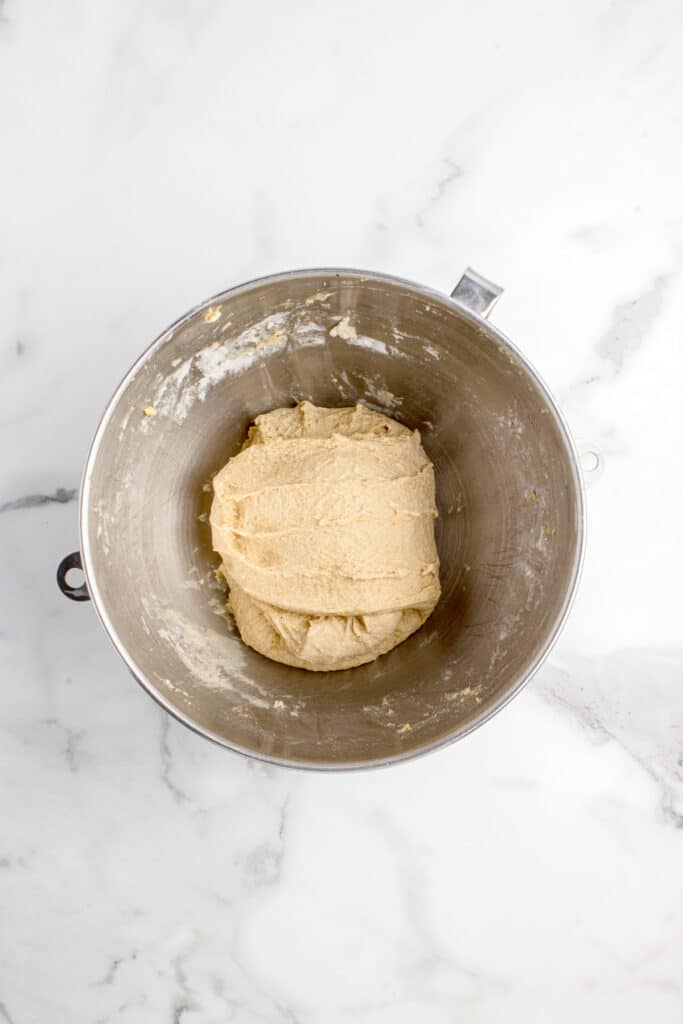metal mixing bowl with dough after series of stretch and folds