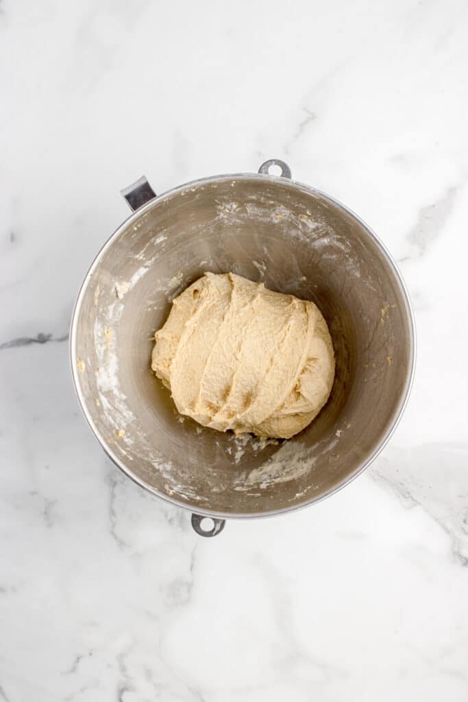 metal mixing bowl with dough after series of stretch and folds