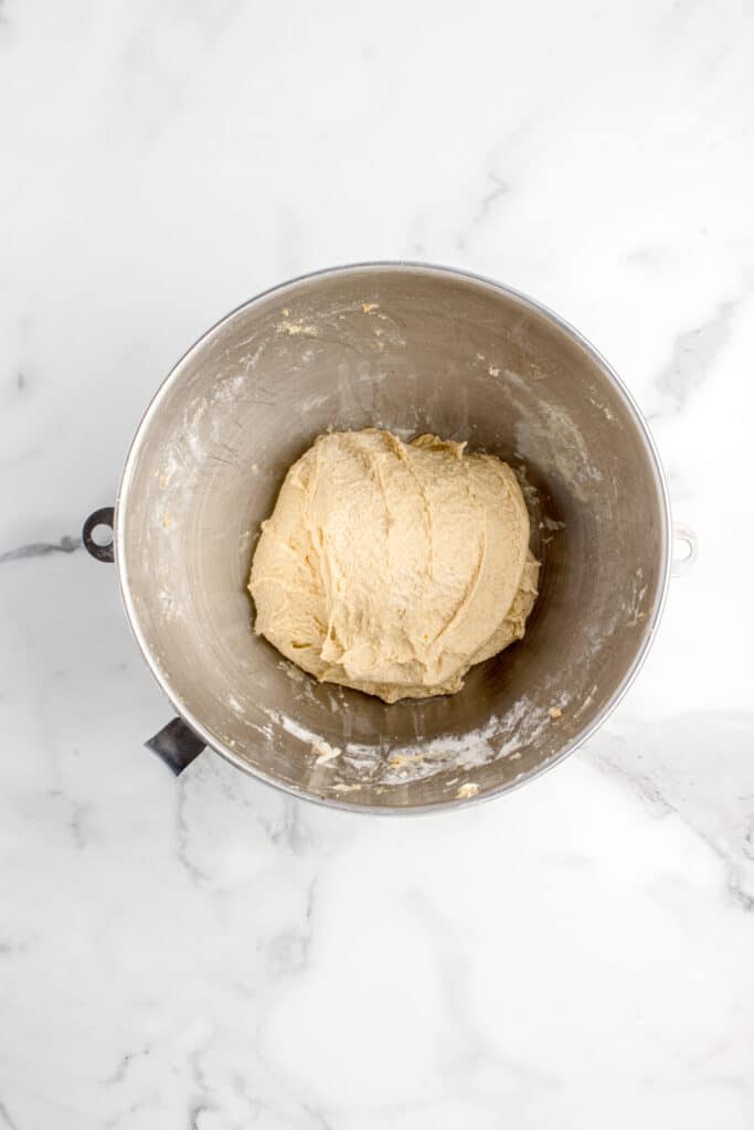 metal mixing bowl with dough after series of stretch and folds