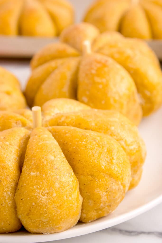 sourdough pumpkin rolls on white plate