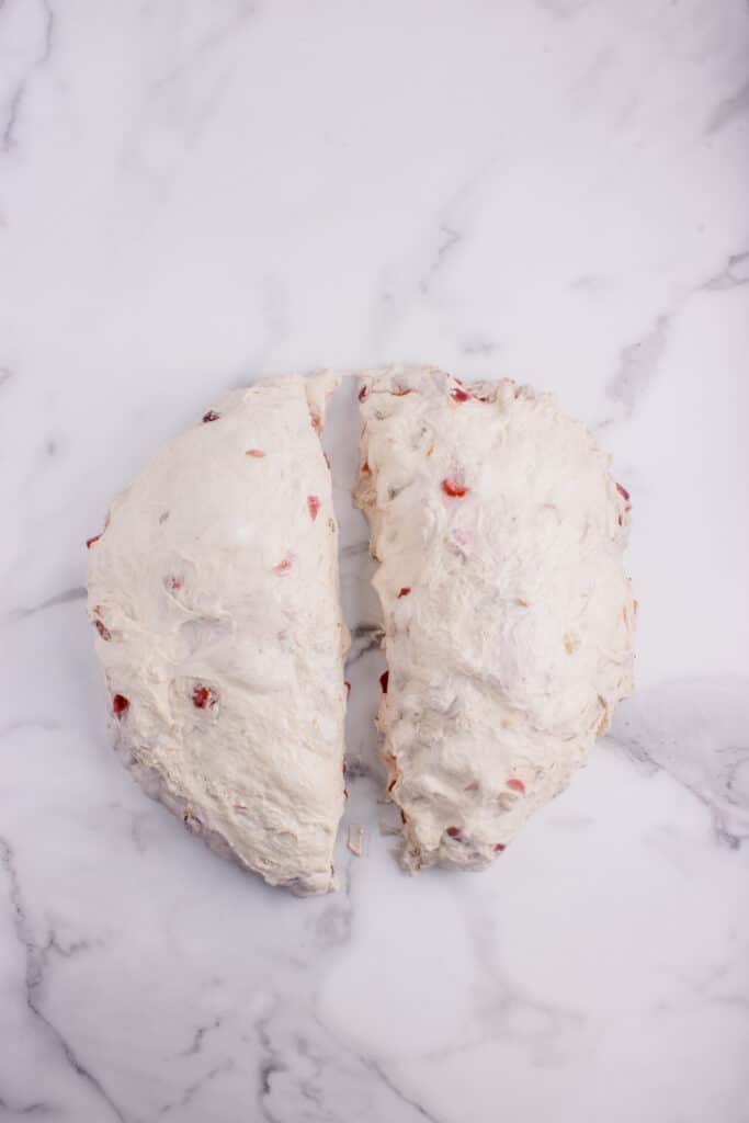 sourdough cranberry bread dough cut in half for two loaves