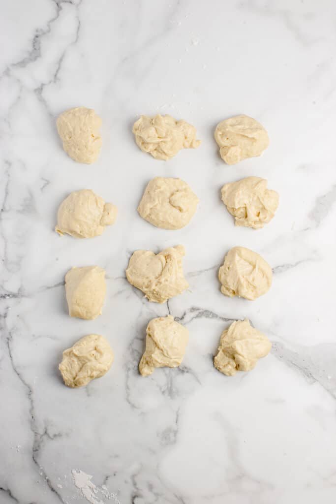 12 pieces of dough divided for donuts