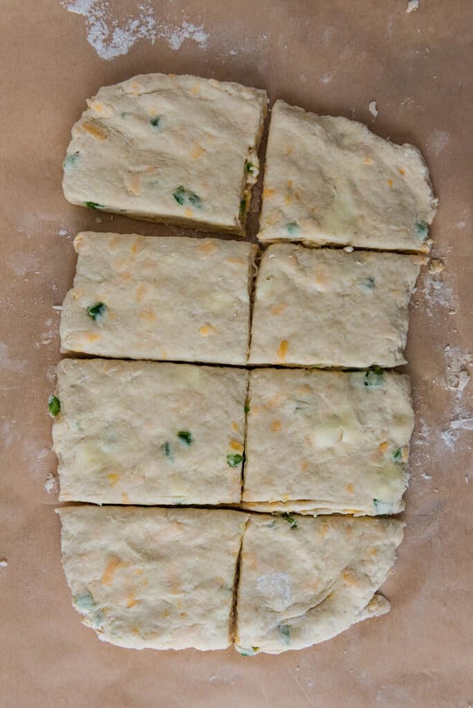 dough for sourdough biscuits with cheddar cheese and jalapeños cut into squares