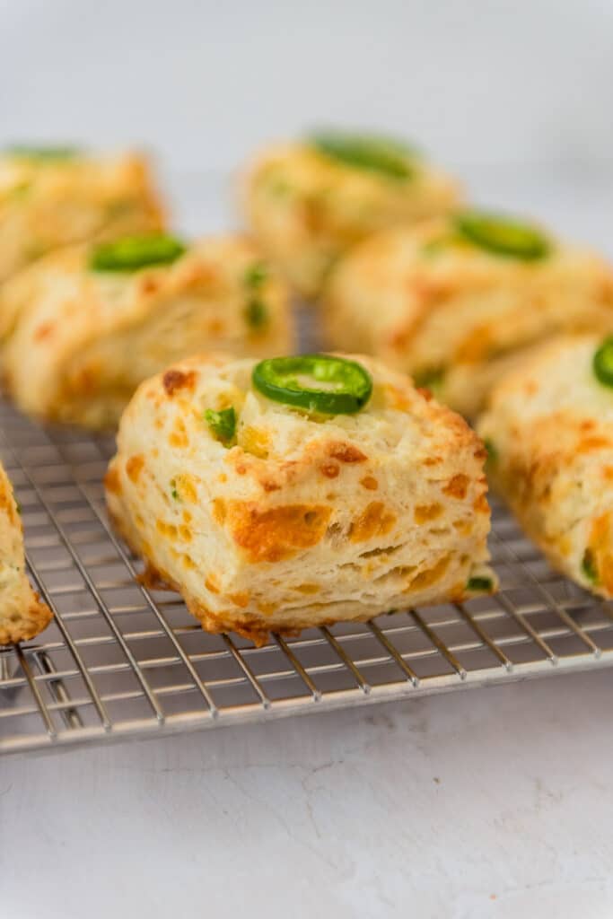 sourdough jalapeno cheddar biscuits on cooling rack