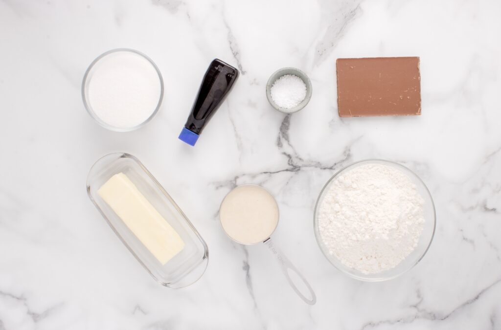 overhead view of ingredients for discard shortbread cookies on marble counter